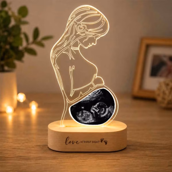 Personalized pregnancy ultrasound LED acrylic lamp with custom baby scan and wooden LED base.