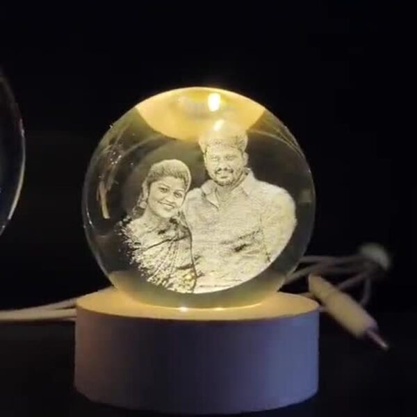 Couple photo engraved inside a glowing 3D crystal ball lamp on LED wooden base