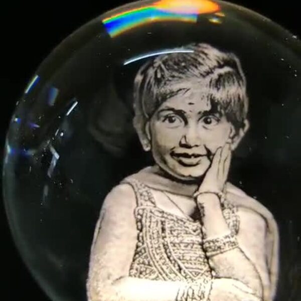 Child portrait laser engraved inside a 3D crystal ball lamp